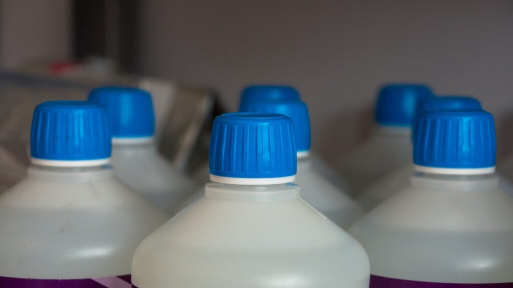 a picture of bleach bottles ready to be recycled