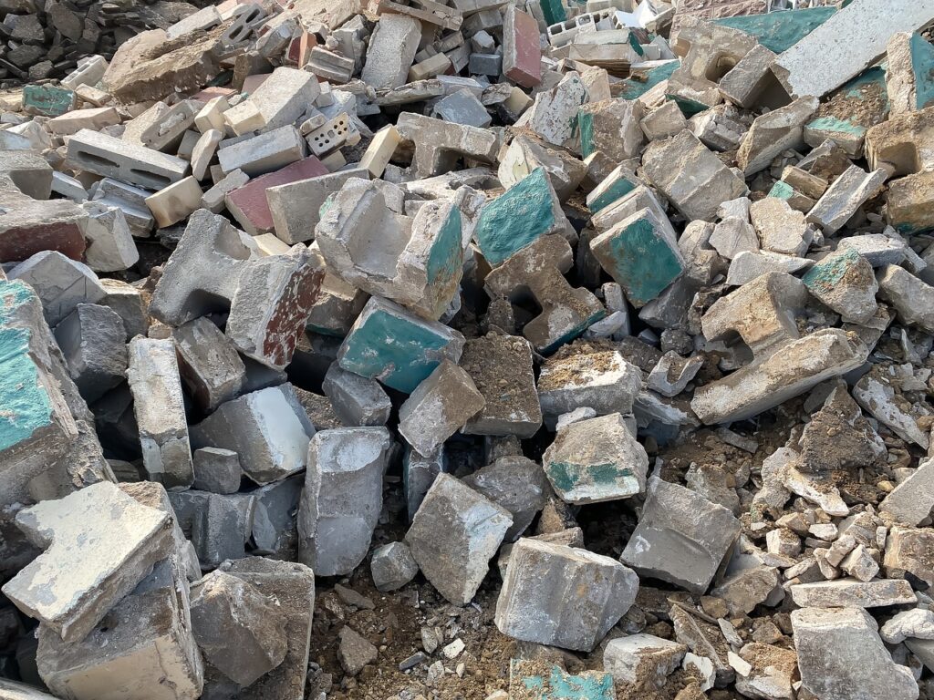 brick and concrete skip bin - debris